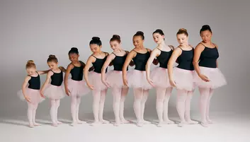 a group of dancers wearing tutus