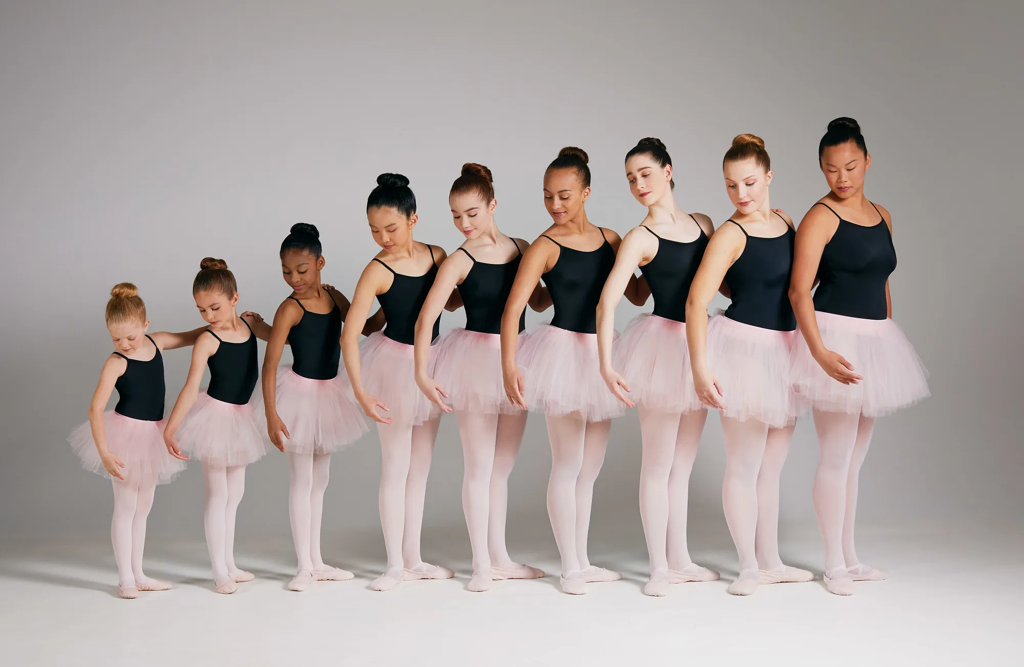 a group of dancers wearing ballet skirts and tutus