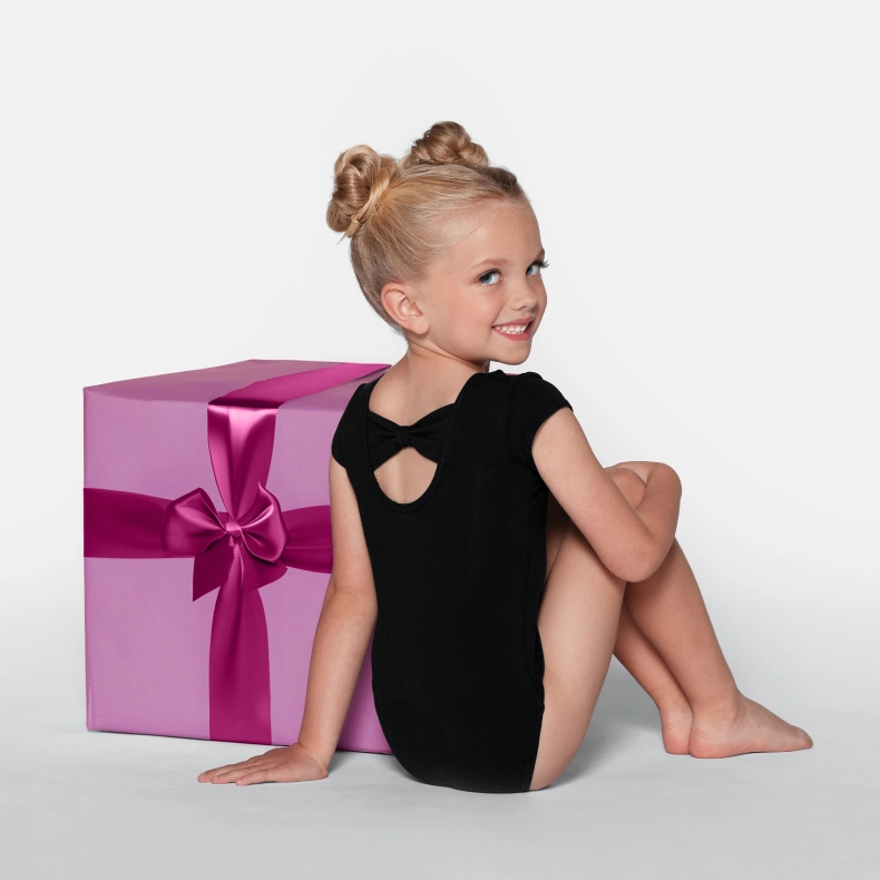 one model wearing kids leotard with present